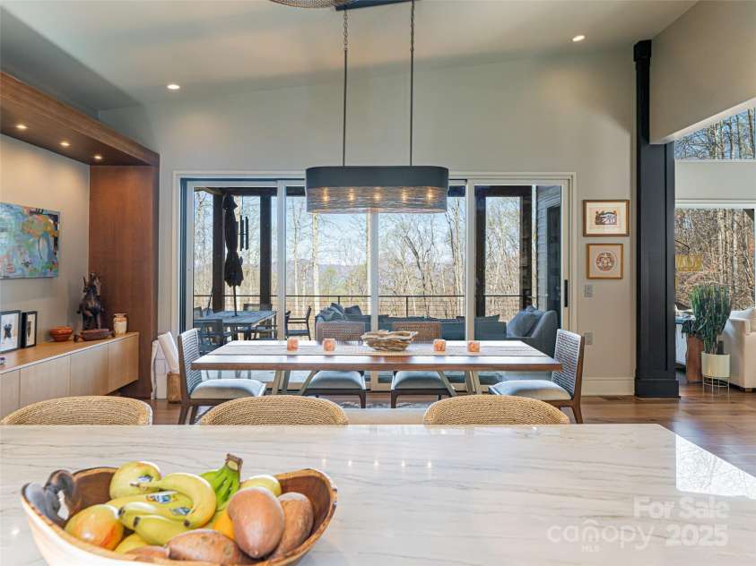 391 High Hickory Trail, Swannanoa, NC 28778.  MLS# CAR4255021, YatesRealty ID 12669. Kitchen Island looking to deck