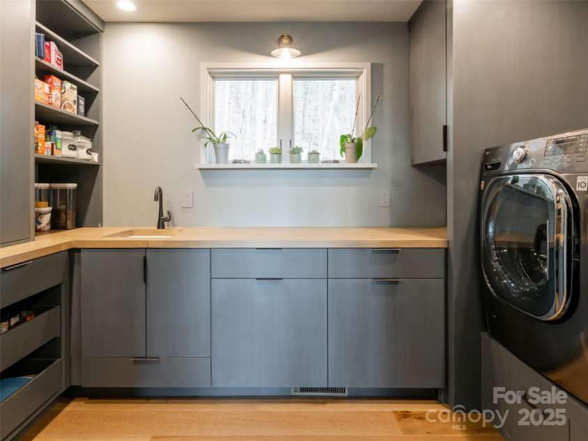 391 High Hickory Trail, Swannanoa, NC 28778.  MLS# CAR4255021, YatesRealty ID 12669. Large Custom Laundry Room/Pantry with LG Washer and Dryer, many built-ins,Utility Sink