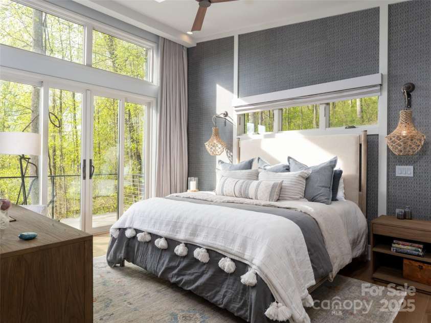 391 High Hickory Trail, Swannanoa, NC 28778.  MLS# CAR4255021, YatesRealty ID 12669. Large Primary Suite - sliding doors to private deck