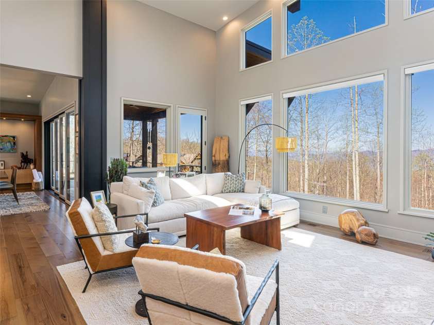 391 High Hickory Trail, Swannanoa, NC 28778.  MLS# CAR4255021, YatesRealty ID 12669. Living Room to Dining Room