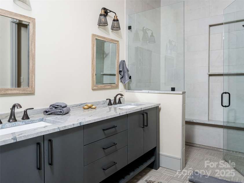 391 High Hickory Trail, Swannanoa, NC 28778.  MLS# CAR4255021, YatesRealty ID 12669. One of two lower level baths