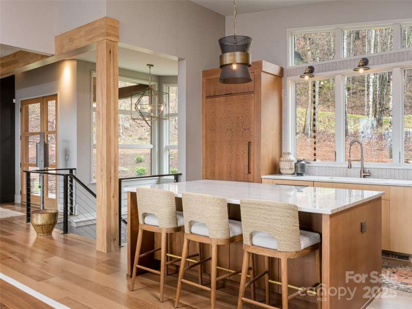 391 High Hickory Trail, Swannanoa, NC 28778.  MLS# CAR4255021, YatesRealty ID 12669. Quartzite counters, marble tile backsplash, maple cabinetry