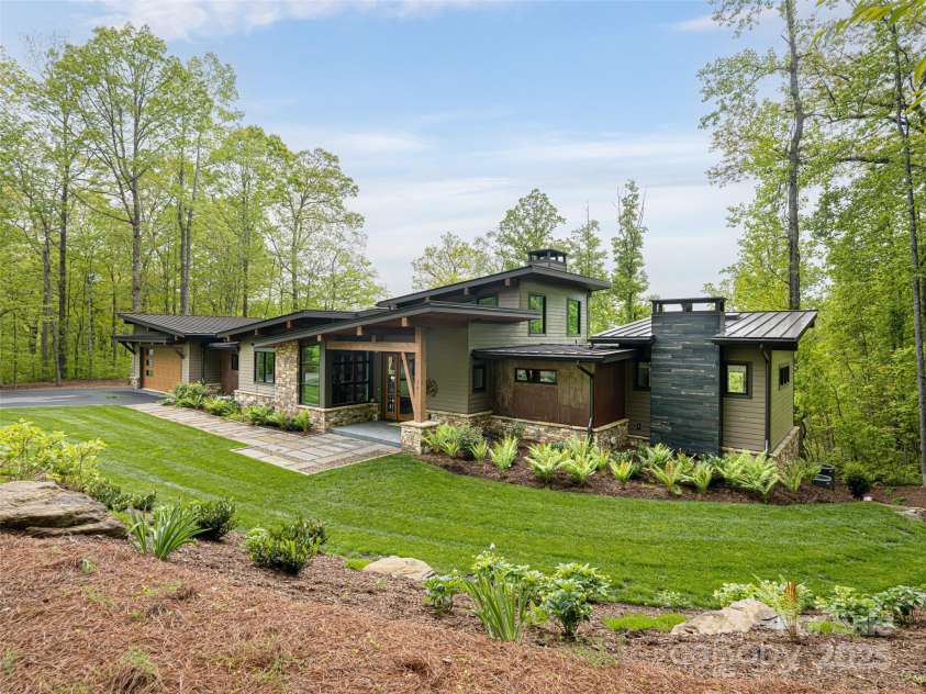 391 High Hickory Trail, Swannanoa, NC 28778.  MLS# CAR4255021, YatesRealty ID 12669. Stunning Livingstone Custom HomeStone, Cedar and Metal Exterior