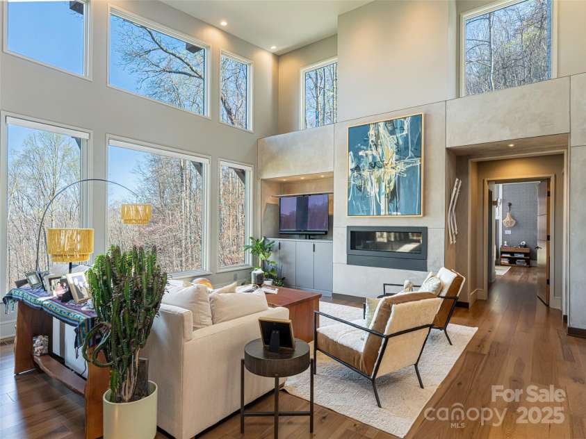 391 High Hickory Trail, Swannanoa, NC 28778.  MLS# CAR4255021, YatesRealty ID 12669. Two-story Living Room with Commanding Gas Fireplace