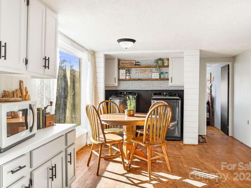 1178 Fork Road, Marshall, NC 28753.  MLS# CAR4219745, YatesRealty ID 12676. Dining area & laundry in kitchen