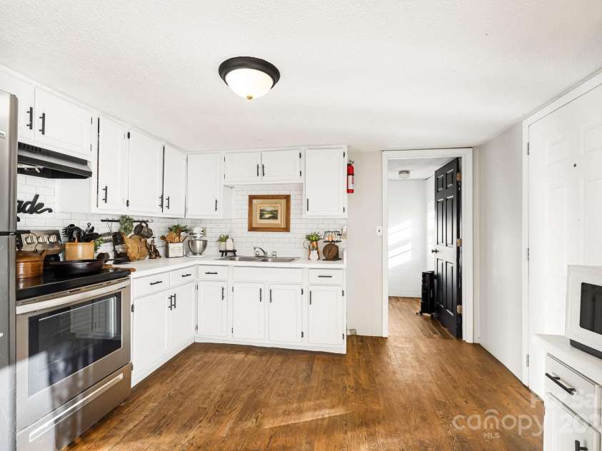 1178 Fork Road, Marshall, NC 28753.  MLS# CAR4219745, YatesRealty ID 12676. Kitchen and door to full bath