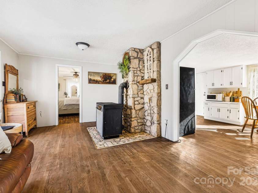 1178 Fork Road, Marshall, NC 28753.  MLS# CAR4219745, YatesRealty ID 12676. Living room looking into kitchen