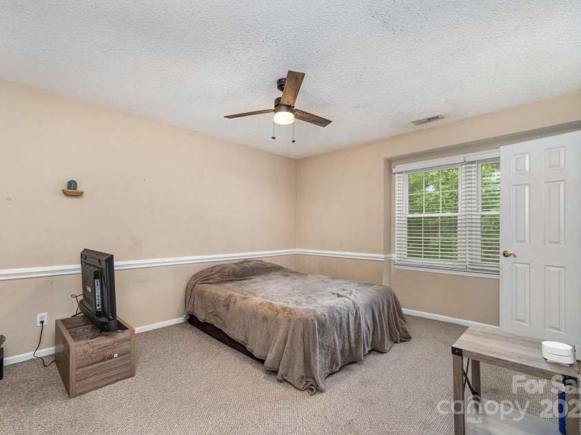 2000 Shannon Bridge Lane, Matthews, NC 28105.  MLS# CAR4218268, YatesRealty ID 12680. Upstairs bedroom