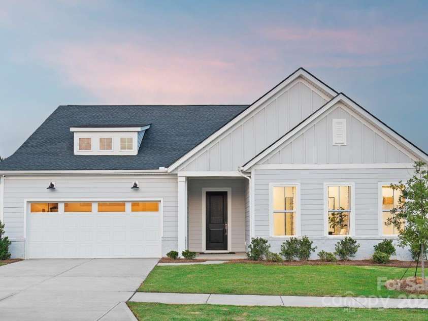 5209 Mint Harbor Way, Charlotte, NC 28269.  MLS# CAR4156538, YatesRealty ID 12683. Please note that the image shown is of a model home and is intended for illustrative purposes only. Features and finishes may vary in the actual units.