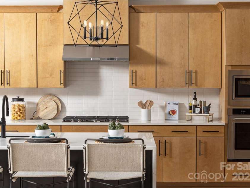 5209 Mint Harbor Way, Charlotte, NC 28269.  MLS# CAR4156538, YatesRealty ID 12683. Please note that the image shown is of a model home and is intended for illustrative purposes only. Features and finishes may vary in the actual units.