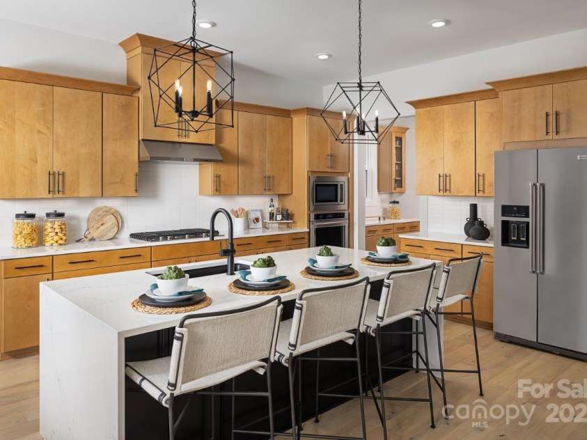5209 Mint Harbor Way, Charlotte, NC 28269.  MLS# CAR4156538, YatesRealty ID 12683. Please note that the image shown is of a model home and is intended for illustrative purposes only. Features and finishes may vary in the actual units.