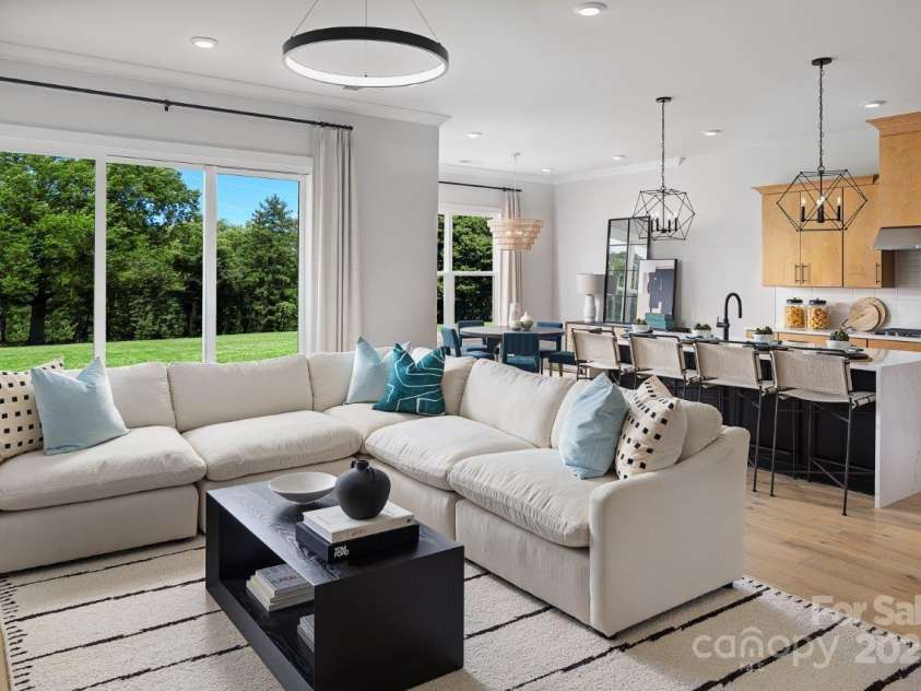 5209 Mint Harbor Way, Charlotte, NC 28269.  MLS# CAR4156538, YatesRealty ID 12683. Please note that the image shown is of a model home and is intended for illustrative purposes only. Features and finishes may vary in the actual units.