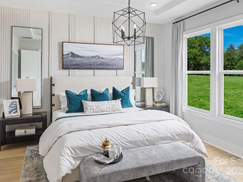 5209 Mint Harbor Way, Charlotte, NC 28269.  MLS# CAR4156538, YatesRealty ID 12683. Please note that the image shown is of a model home and is intended for illustrative purposes only. Features and finishes may vary in the actual units.