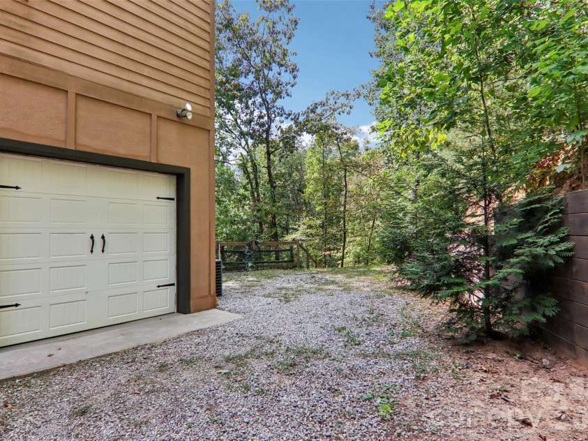 184 Deep Woods Lane, Saluda, NC 28773.  MLS# CAR4333233, YatesRealty ID 12686. Garage for 1 car.