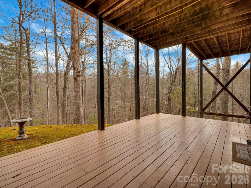 184 Deep Woods Lane, Saluda, NC 28773.  MLS# CAR4333233, YatesRealty ID 12686. Lower level has a private entrance and this huge covered deck area.