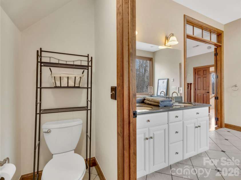 184 Deep Woods Lane, Saluda, NC 28773.  MLS# CAR4333233, YatesRealty ID 12686. Water Closet with Linen Storage