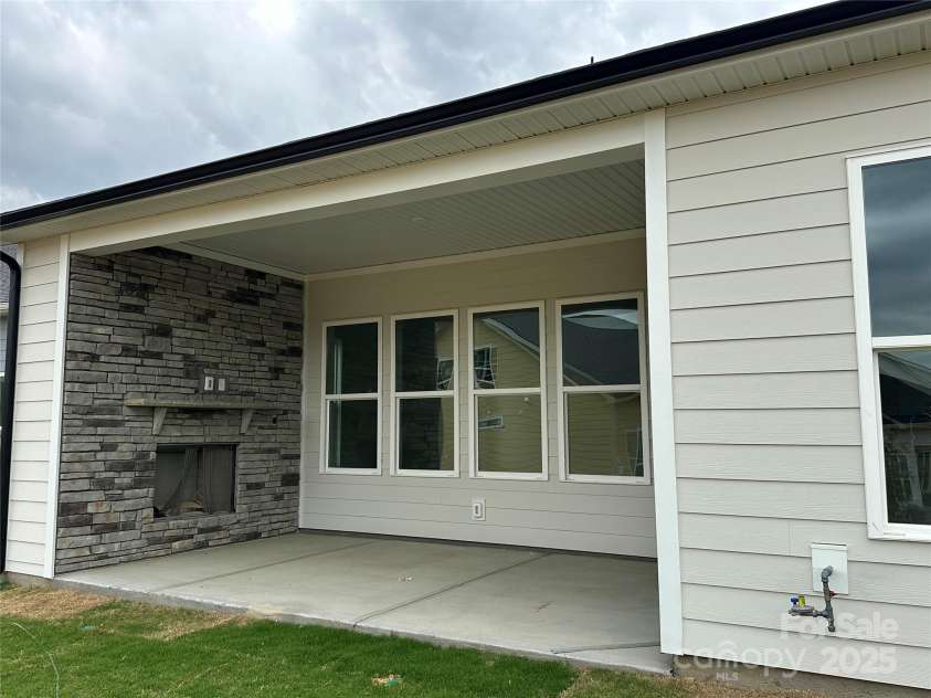 5205 Mint Harbor Way, Charlotte, NC 28269.  MLS# CAR4241159, YatesRealty ID 12686. Covered porch with Exterior Fireplace