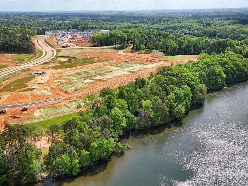 5205 Mint Harbor Way, Charlotte, NC 28269.  MLS# CAR4241159, YatesRealty ID 12686. Private 17-Acre community lake