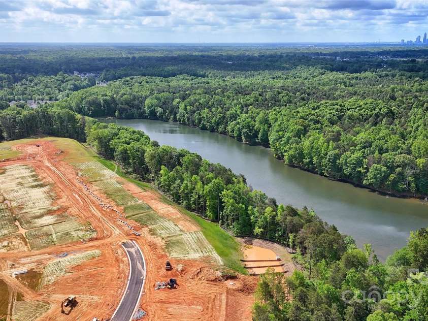 5205 Mint Harbor Way, Charlotte, NC 28269.  MLS# CAR4241159, YatesRealty ID 12686. Private 17-Acre community lake