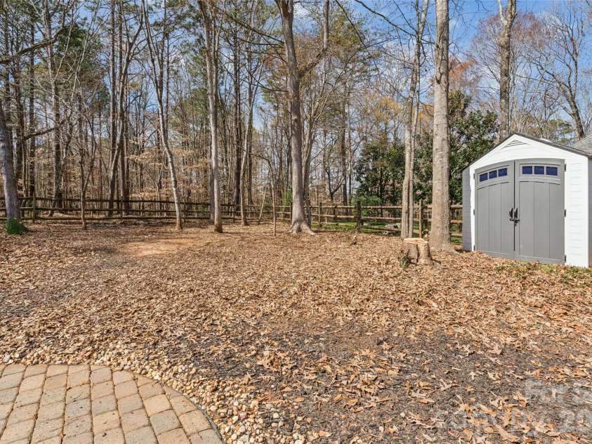8307 Poplar Grove Circle, Waxhaw, NC 28173.  MLS# CAR4357386, YatesRealty ID 12689. Back Yard Storage Shed