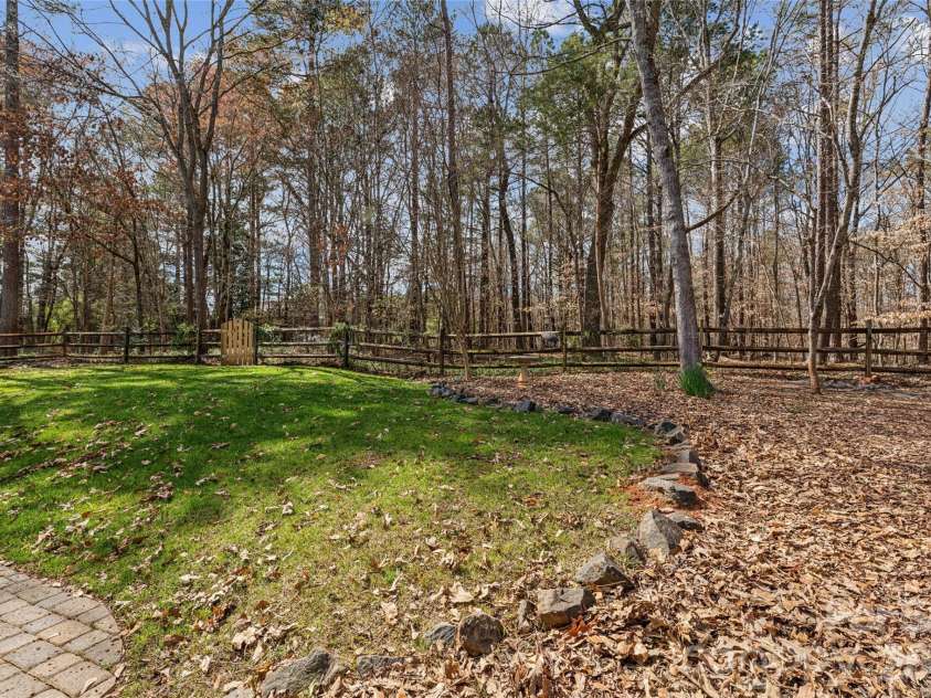 8307 Poplar Grove Circle, Waxhaw, NC 28173.  MLS# CAR4357386, YatesRealty ID 12689. Private Yard backs up to Woods