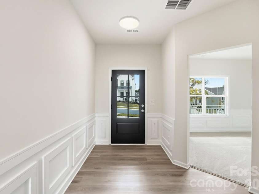 17909 Wilbanks Drive, Charlotte, NC 28278.  MLS# CAR4364271, YatesRealty ID 12694. As you step inside, you are immediately greeted by an open-concept floor plan defined by soaring ceilings and an abundance of natural light streaming through oversized windows that frame the spectacular water views