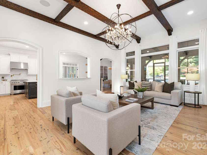 7311 Barrington Ridge Drive, Fort Mill, SC 29707.  MLS# CAR4310703, YatesRealty ID 12696. Family room with coffered beam ceiling and stone fireplace