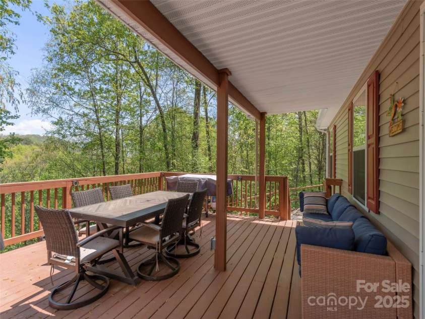 860 Creekside Drive, Maggie Valley, NC 28751.  MLS# CAR4245544, YatesRealty ID 12700. Outdoor living at its finest!  This spacious deck offers ample room for entertaining and unwinding in the fresh mountain air!