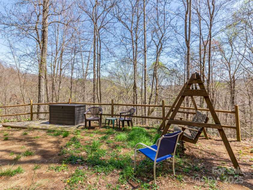 860 Creekside Drive, Maggie Valley, NC 28751.  MLS# CAR4245544, YatesRealty ID 12700. Side yard.