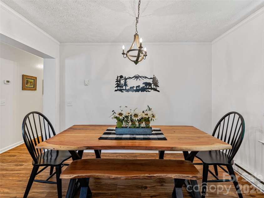 860 Creekside Drive, Maggie Valley, NC 28751.  MLS# CAR4329432, YatesRealty ID 12700. Dining area between kitchen and living room