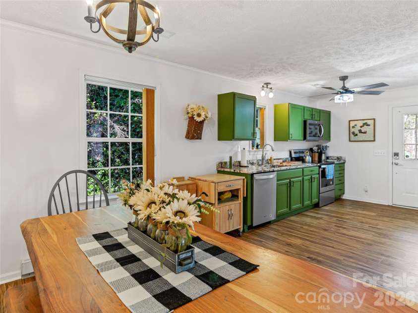 860 Creekside Drive, Maggie Valley, NC 28751.  MLS# CAR4329432, YatesRealty ID 12700. View of kitchen from dining area