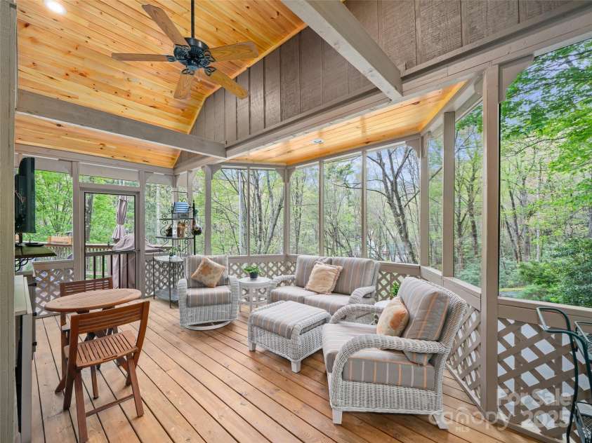 86 Laurel Drive, Burnsville, NC 28714.  MLS# CAR4253522, YatesRealty ID 12702. Screened in porch for outdoor enjoyment complete with sounds of the waterfalls of the creek on the property