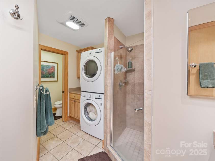 86 Laurel Drive, Burnsville, NC 28714.  MLS# CAR4253522, YatesRealty ID 12702. Washer and Dryer off the Primary Bath for convenience 