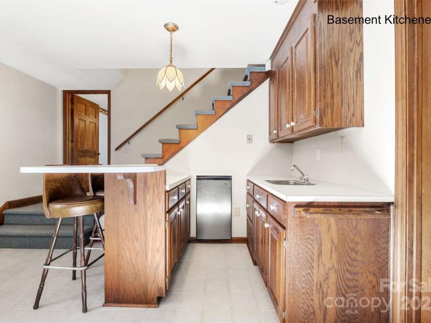 5303 Rogers Road, Monroe, NC 28110.  MLS# CAR4312504, YatesRealty ID 12706. Wet bar in lower level family room