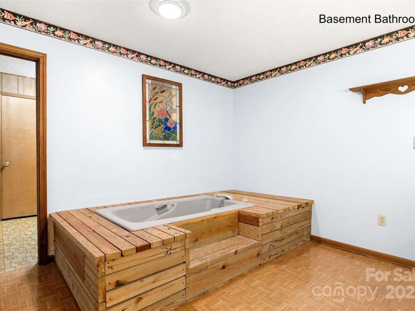 5303 Rogers Road, Monroe, NC 28110.  MLS# CAR4312504, YatesRealty ID 12706. Whirlpool tub in lower level bath