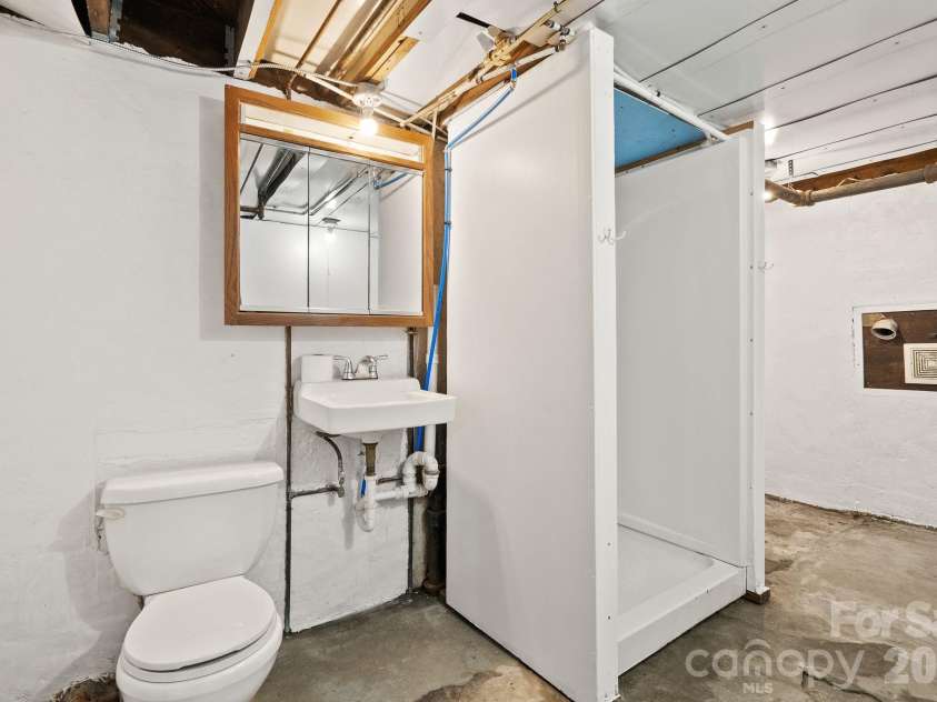 15 Conestee Place, Asheville, NC 28801.  MLS# CAR4358029, YatesRealty ID 12711. Basement bathroom.