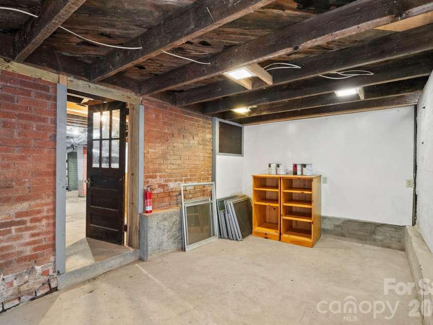 15 Conestee Place, Asheville, NC 28801.  MLS# CAR4358029, YatesRealty ID 12711. Storage space abounds.