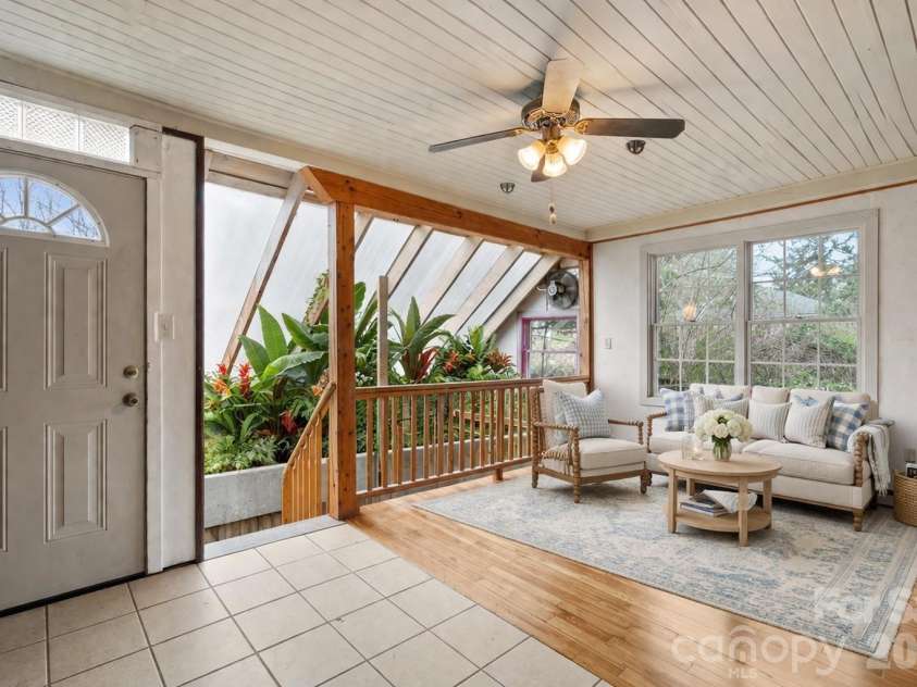 15 Conestee Place, Asheville, NC 28801.  MLS# CAR4358029, YatesRealty ID 12711. Virtually staged and virtually gardened - lovely sunroom creates more space for gracious living.