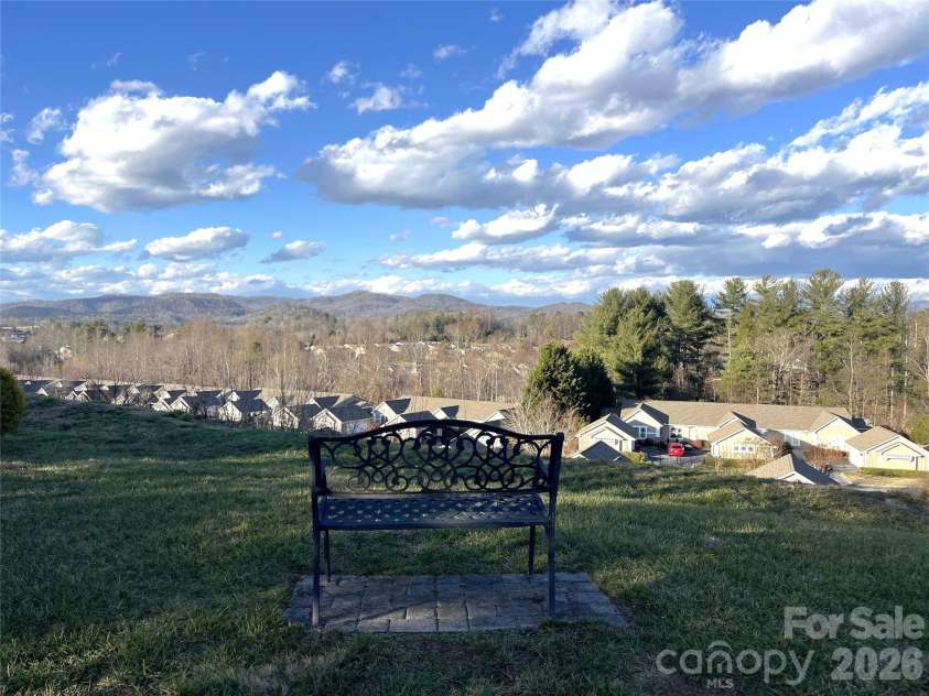 51 Barn Owl Way, Hendersonville, NC 28792.  MLS# CAR4394410, YatesRealty ID 12718. Common Area Sitting Bench Mountain View