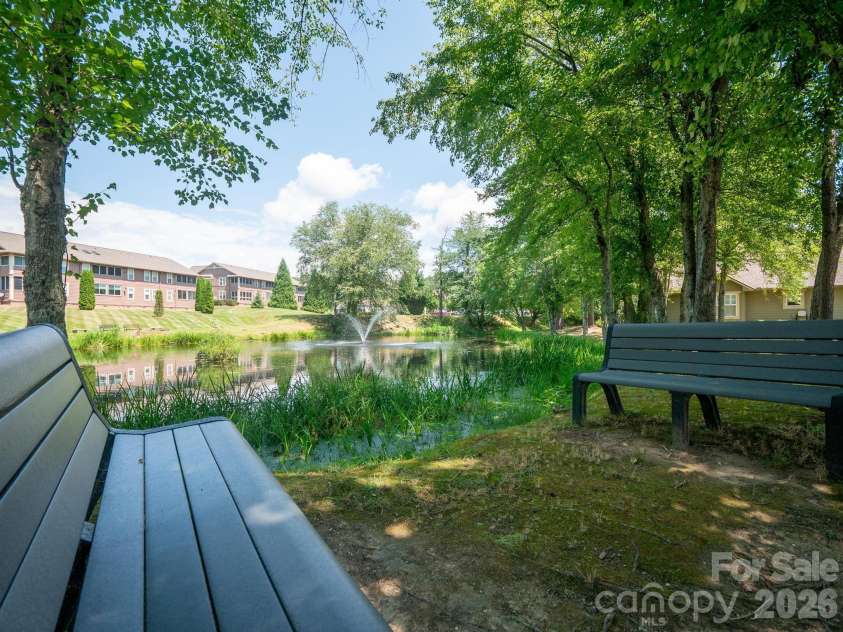 51 Barn Owl Way, Hendersonville, NC 28792.  MLS# CAR4394410, YatesRealty ID 12718. Community Pond Sitting Area