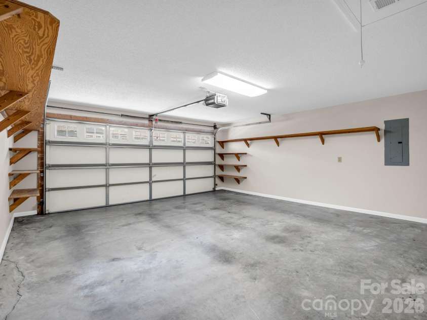 51 Barn Owl Way, Hendersonville, NC 28792.  MLS# CAR4394410, YatesRealty ID 12718. Garage w/Storage Shelves