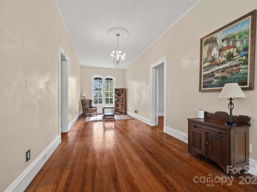 121 Congress Street, York, SC 29745.  MLS# CAR4235428, YatesRealty ID 12723. Charming Upper HallThis wide upper-level hallway with hardwood floors and arched windows offers both functionality and charm, leading to private living spaces with elegance.