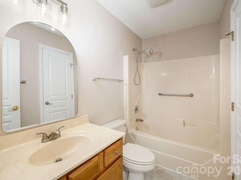 501 Fox Den Court, Hendersonville, NC 28792.  MLS# CAR4361980, YatesRealty ID 12730. Light bright secondary bathroom