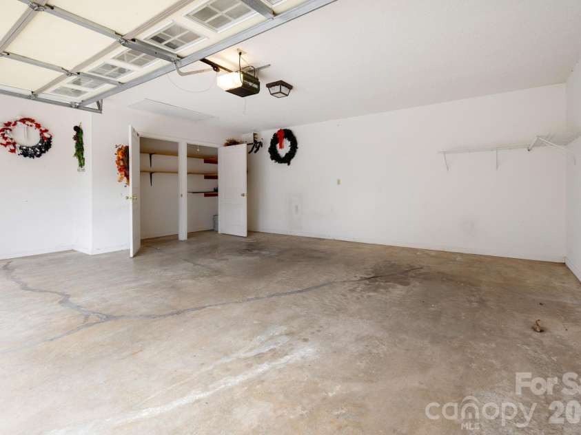 501 Fox Den Court, Hendersonville, NC 28792.  MLS# CAR4361980, YatesRealty ID 12730. Two car garage with additional storage