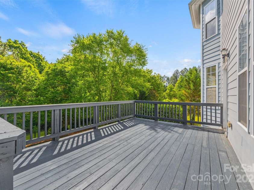 6424 Chadwell Court, Fort Mill, SC 29707.  MLS# CAR4255139, YatesRealty ID 12730. Deck provides access to Backyard Patio and Fire Pit
