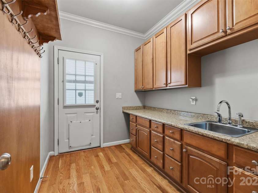 6424 Chadwell Court, Fort Mill, SC 29707.  MLS# CAR4255139, YatesRealty ID 12730. Mud Room with Utility Sink as you enter from Garage