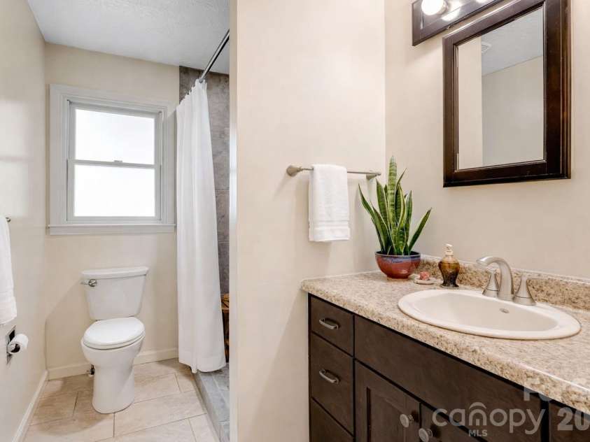6334 Jacks Creek Road, Burnsville, NC 28714.  MLS# CAR4365892, YatesRealty ID 12745. Hall bathroom