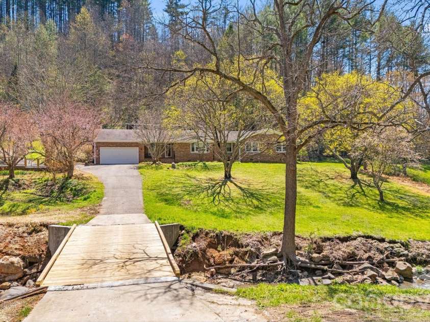 6334 Jacks Creek Road, Burnsville, NC 28714.  MLS# CAR4365892, YatesRealty ID 12745. New bridge.