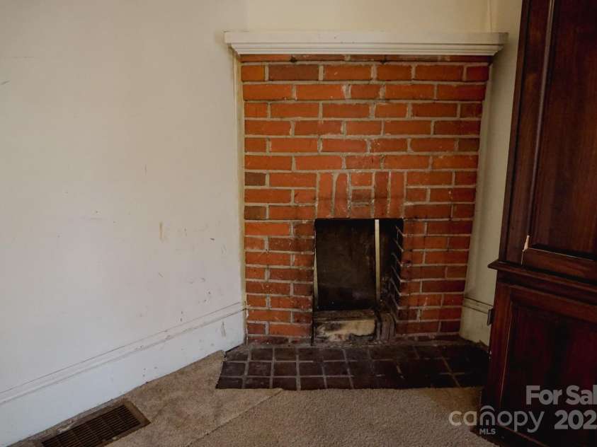 486 Main Street, Forest City, NC 28043.  MLS# CAR4224432, YatesRealty ID 1276. Main - fireplace in priamry