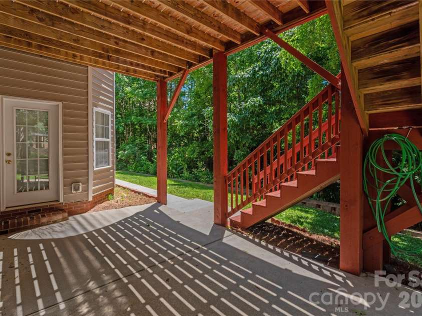 8914 Landsdowne Avenue, Harrisburg, NC 28075.  MLS# CAR4259422, YatesRealty ID 1276. Patio from the basement.